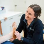 Podiatrist checking client's foot — Podiatrists in Alice Springs, NT